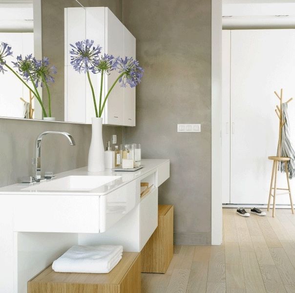 badezimmer grauer betonputz weisser waschtisch agapanthus schrank