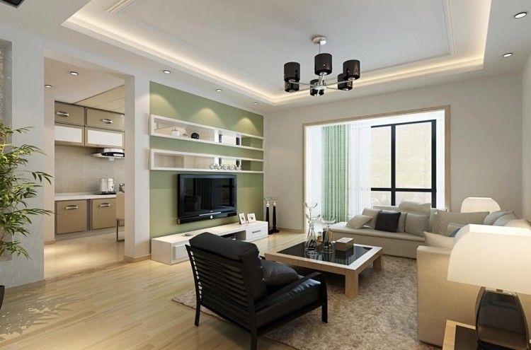 modernes wohnzimmer mit gruener tv wand und heller couch