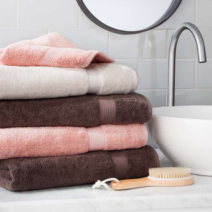 pink brown cotton towel stack vessel sink